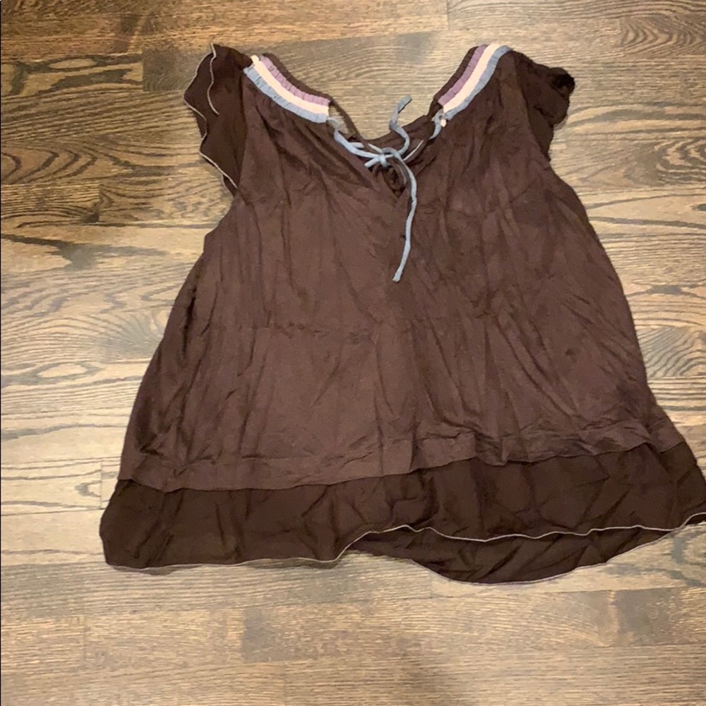 Brown flowing top with ruffles and open neck